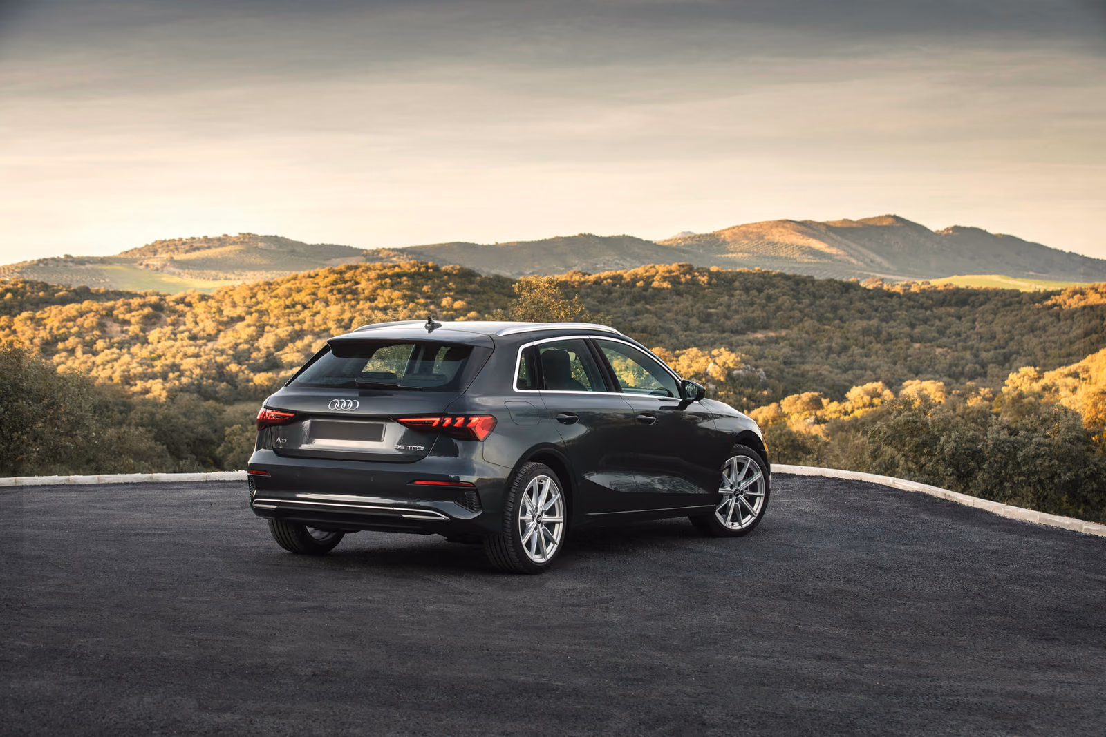 Audi A3 — серый кузов, вид сзади на горной дороге