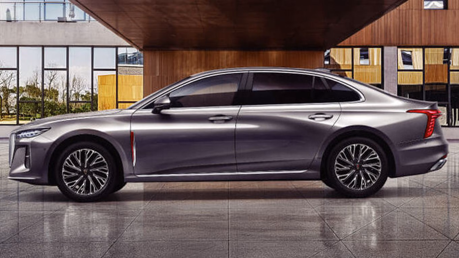 Серый HONGQI H5 в профиль у современной архитектуры