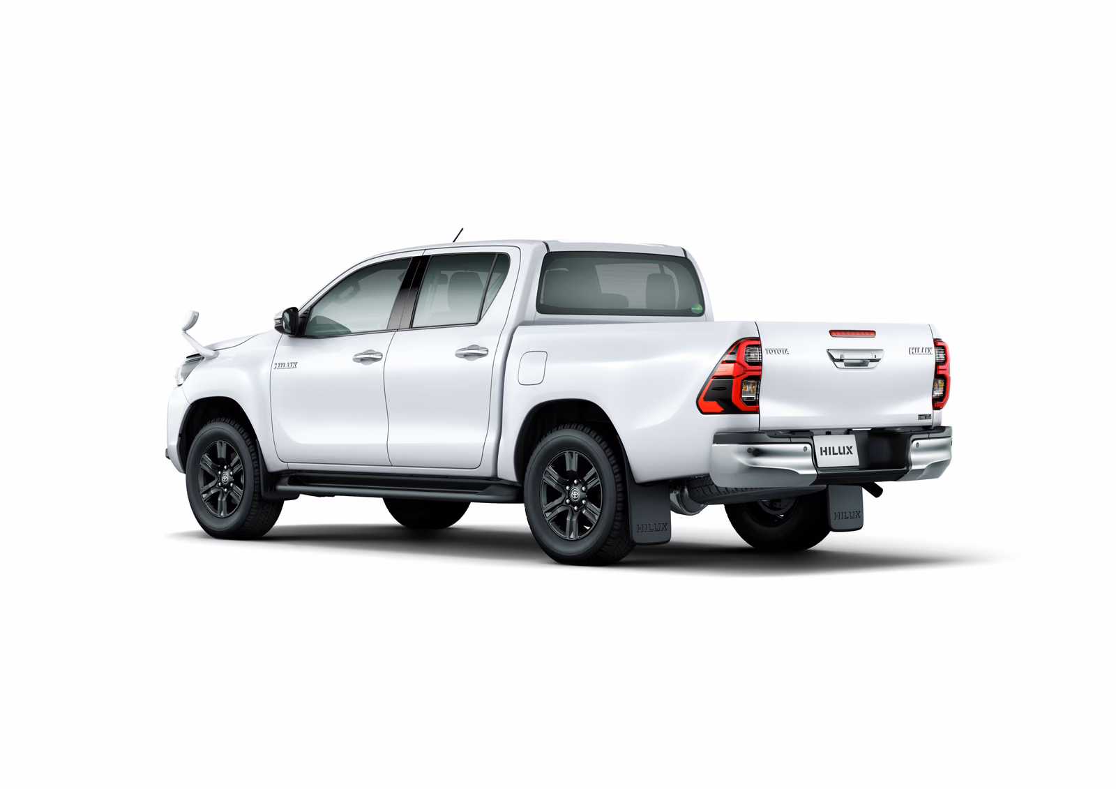 Toyota Hilux — белый кузов сзади в три четверти